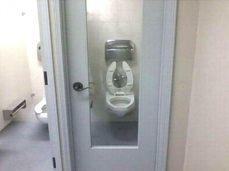 Who wouldn't hesitate to use a bathroom with a door like this?