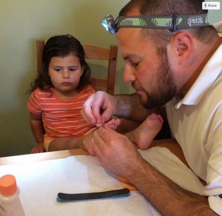 Her first pedicure ... and his concentration is palpable!