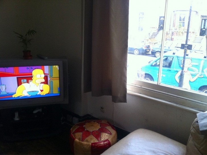 Homer who glances at Marge through the screen and out the window!