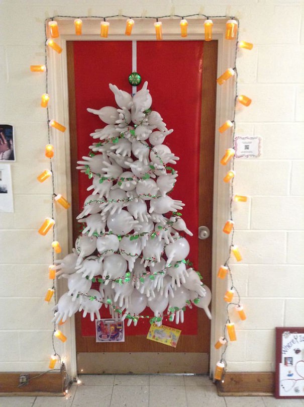 A Christmas decoration on a door in a hospital.
