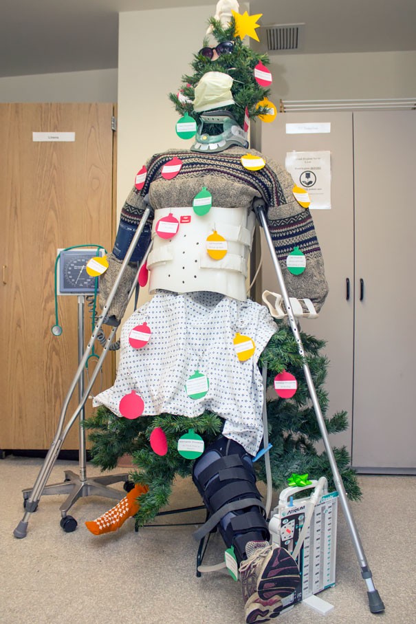 A mannequin used for first-aid training has been transformed into a Christmas tree.