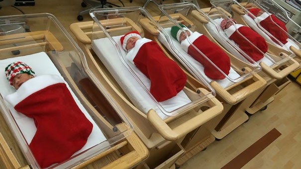 Children born during the holidays are placed in Christmas stockings.