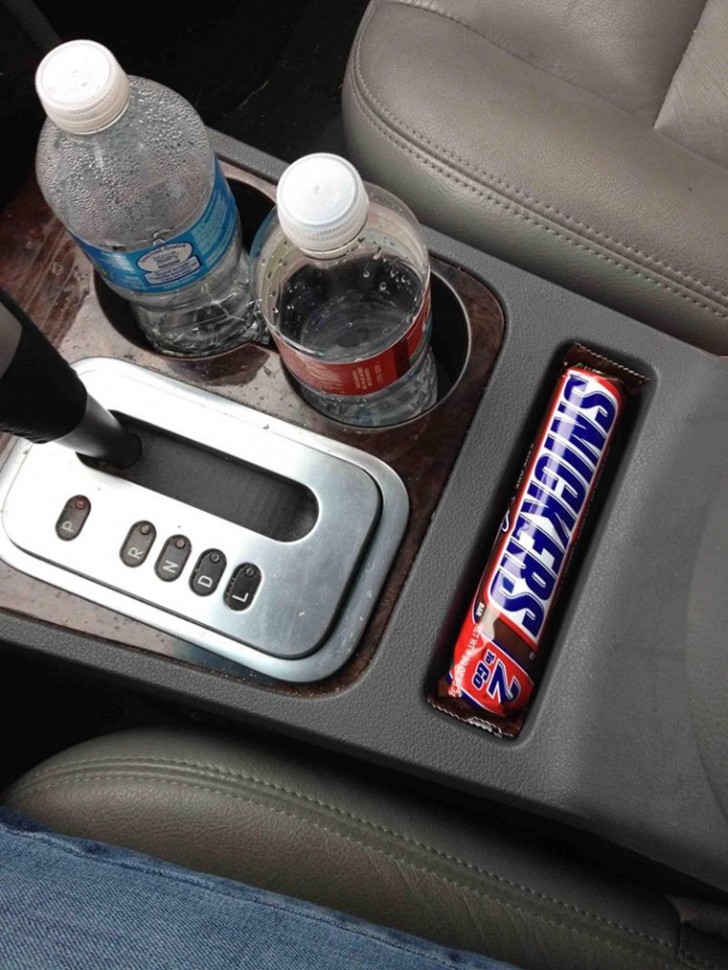 A tray that perfectly holds your favorite snack! You would never change your car just for this reason!