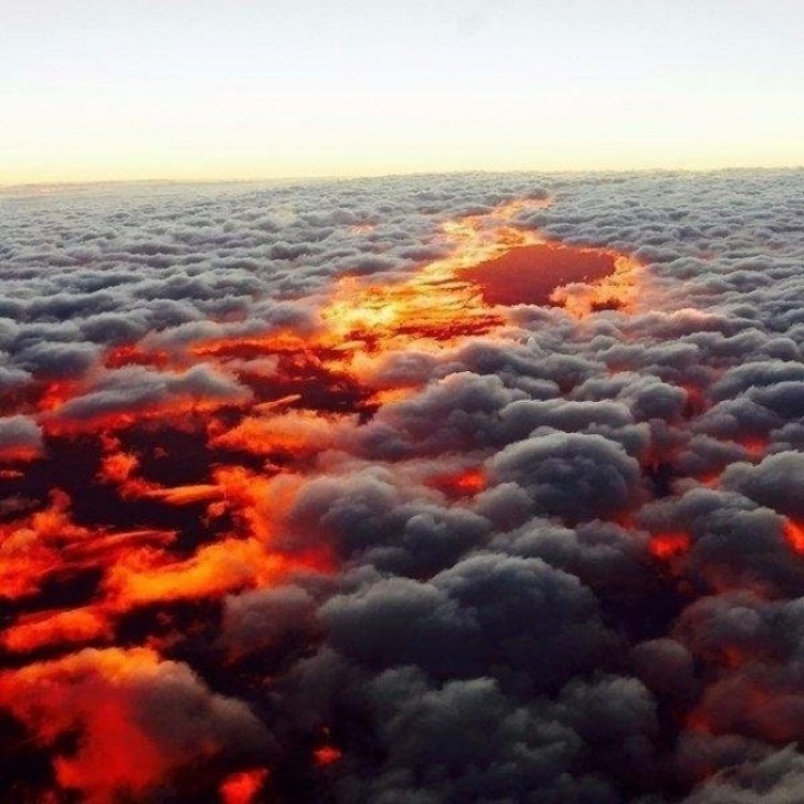 19. Seeing a blazing sunset from above the clouds ... Wow!