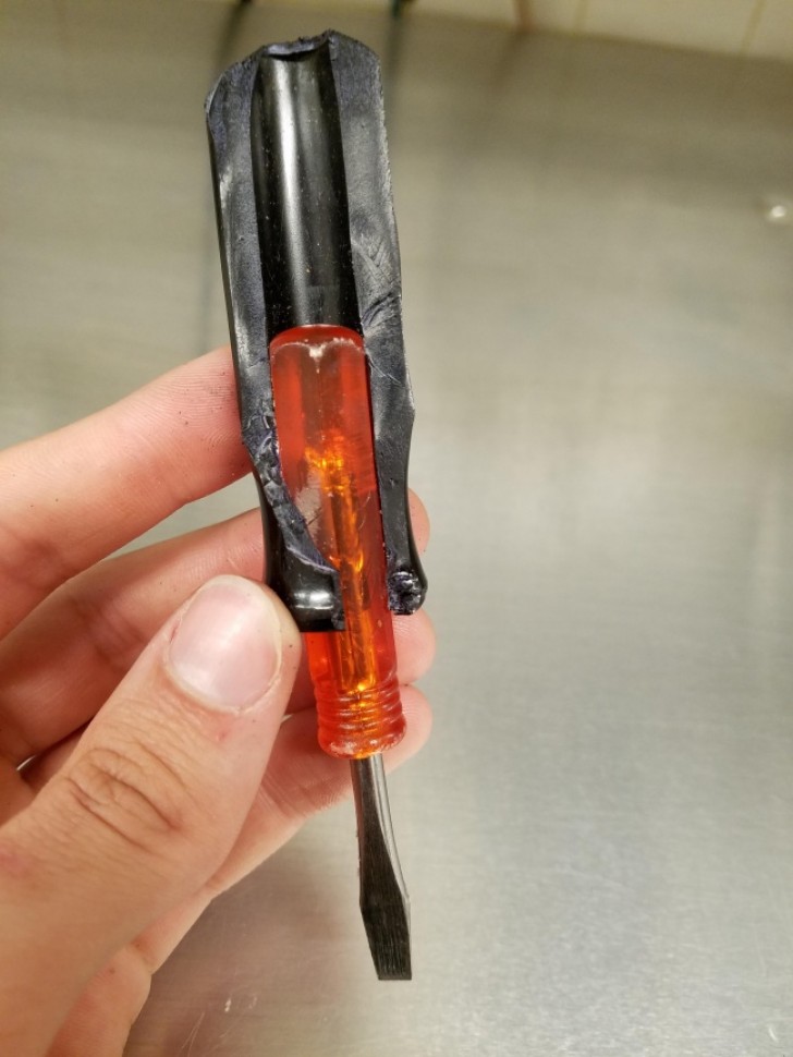 8. An orange screwdriver handle with a black screwdriver handle inside it!