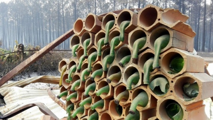 A stack of wine bottles melted by a forest fire in Portugal --- here is the result.