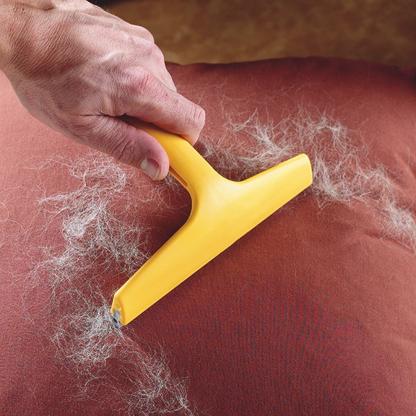 5. Remove pet fur, dust, and hair from the sofa.