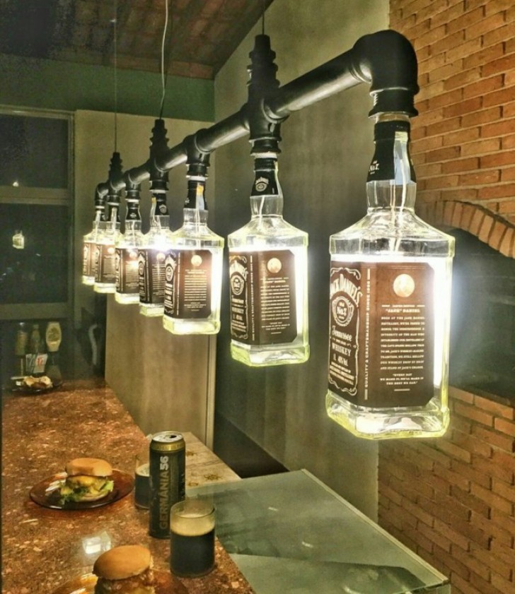 22. Empty whiskey bottles used as decorative lighting.
