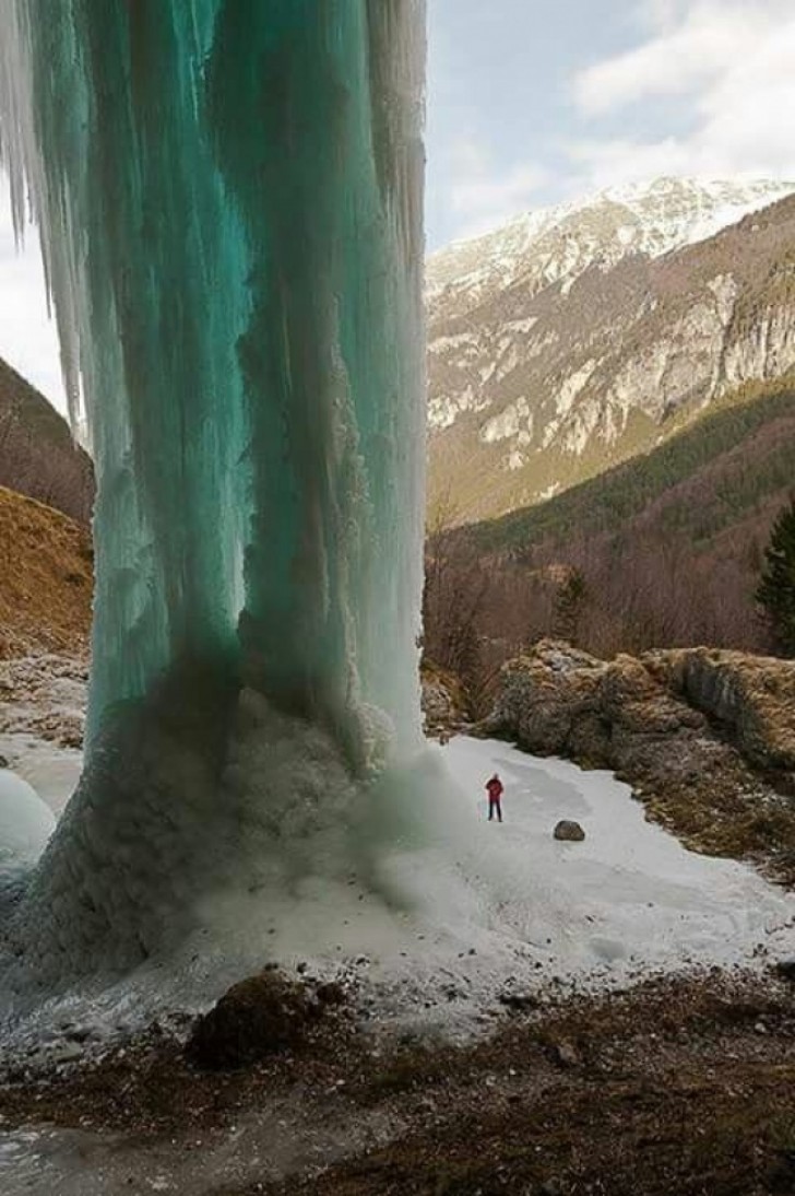 A completely frozen alpine waterfall.