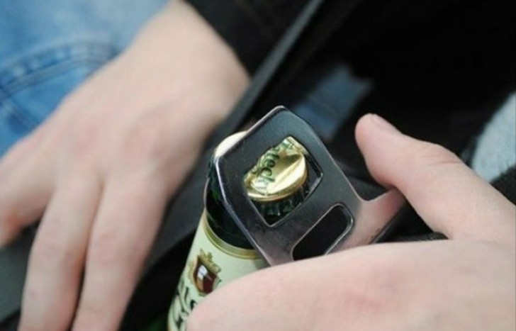 Open a bottle of beer with a seat belt buckle.