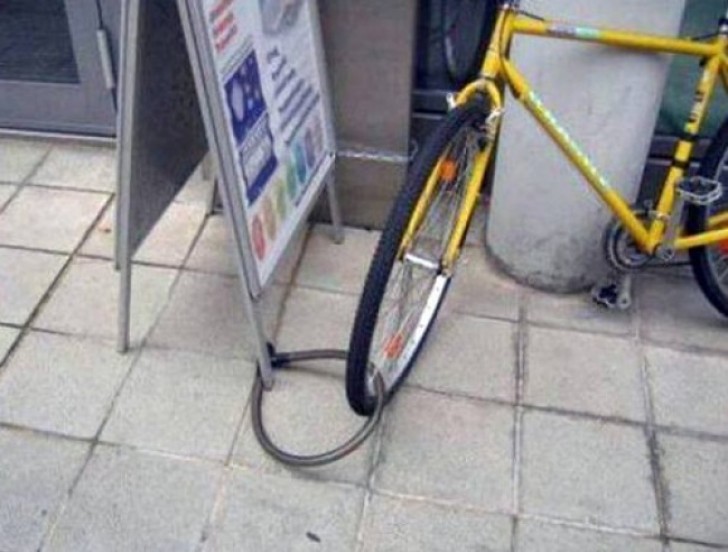 If you have to lock your bike to keep it from being stolen, choose a fixed structure and not a movable publicity board!