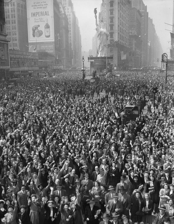 4. A crowd meets in Times Square in 1945 to celebrate WWII Nazi Germany's surrender.