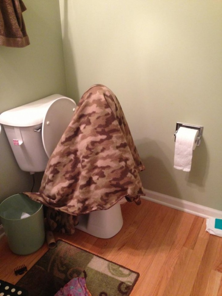 11. This little boy (or girl?) is learning to use the toilet. This is how they go to the bathroom when it is cold!