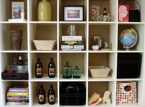 1. The first thing to do is to reduce the number of objects! If you want to waste less time cleaning, just display only the objects you really care about ... stop filling shelves with knick-knacks!