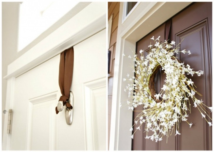 15. Here is a very simple and fast way to hang a garland on a door using just one adhesive hook!