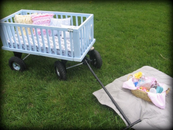 14. If the baby crib you want to upcycle is small, you can turn it into a really adorable picnic wagon!