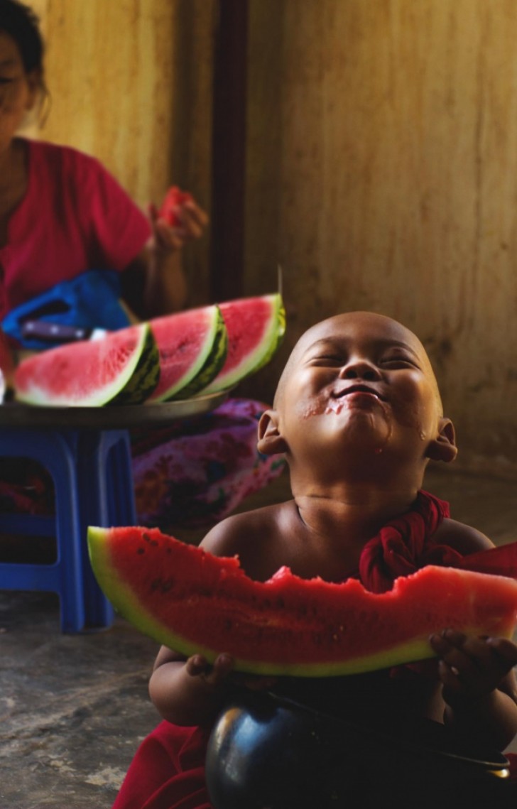 21. Looking at this photo, I can almost feel the sweet juicy taste of the watermelon and the warmth of his happiness!
