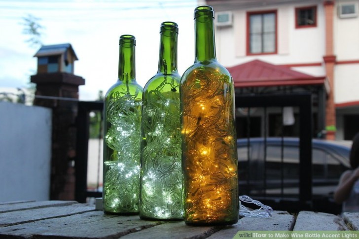 12. Wine bottle accent lights obtained by inserting a string of tiny light bulbs