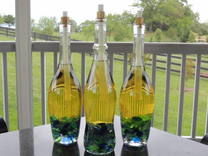 19. Wine Bottle Tiki Torches for summer evenings