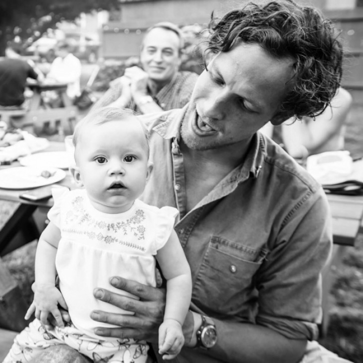 "Three generations in one picture --- in the background is the grandfather and in front of him is his son with his daughter."