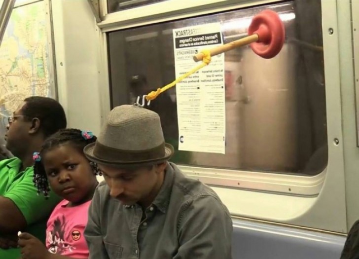 Are we witnessing an exhibition of a live performance on the subway? Someone please, reassure this young girl!