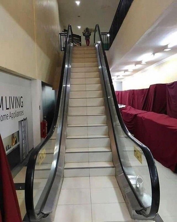 2. Look! ... an escalator or a flight of stairs?