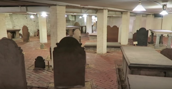 An 18th-century cemetery perfectly preserved inside a modern building that has been built above it.