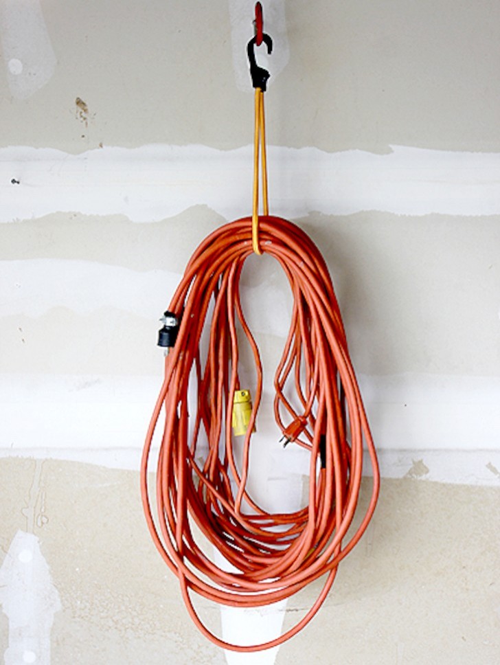 Hang an elastic hook to store your electrical power extension cord, and you will always have it at your fingertips!
