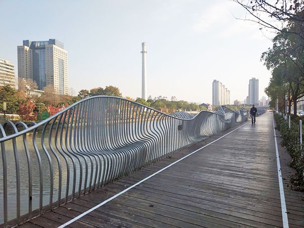 A railing with built-in "benches" --- certainly, the spaces have been optimized but ... would you sit there?