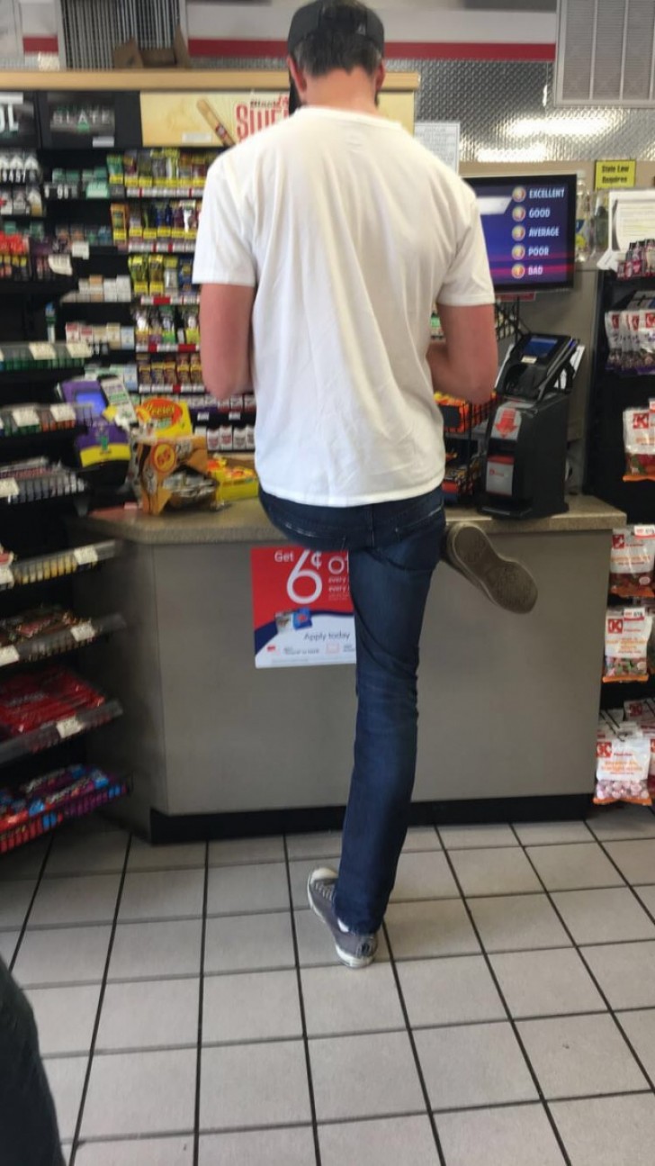 Okay, you are tall, but is this really the way to wait at the checkout counter?