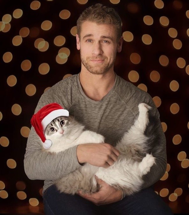 "My husband lets himself be photographed only once a year. This time I convinced him to pose with my cat, Nikon!"