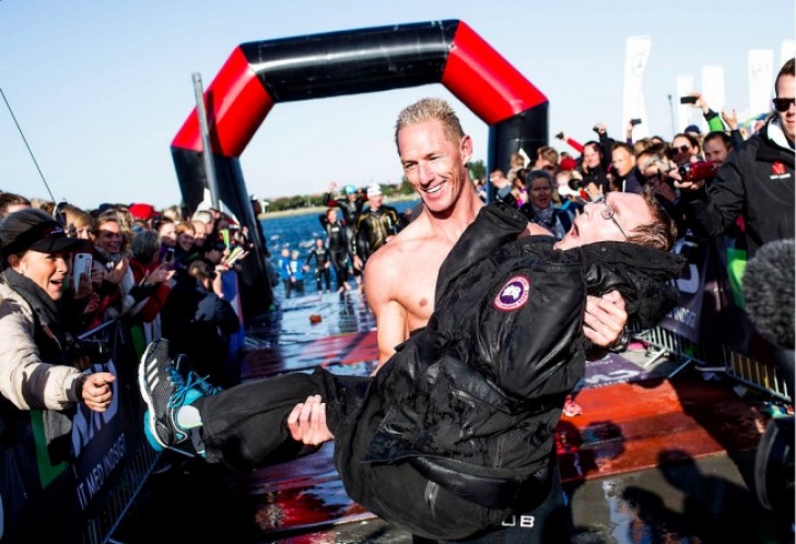 A man carried his disabled brother in his arms for the entire running segment of a triathlon competition.
