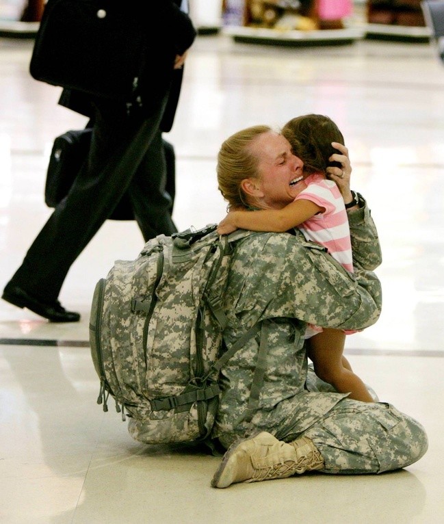 American soldier Terri Gurrola reunites with her daughter, after having been seven months in Iraq --- an infinite amount of time for a mother.