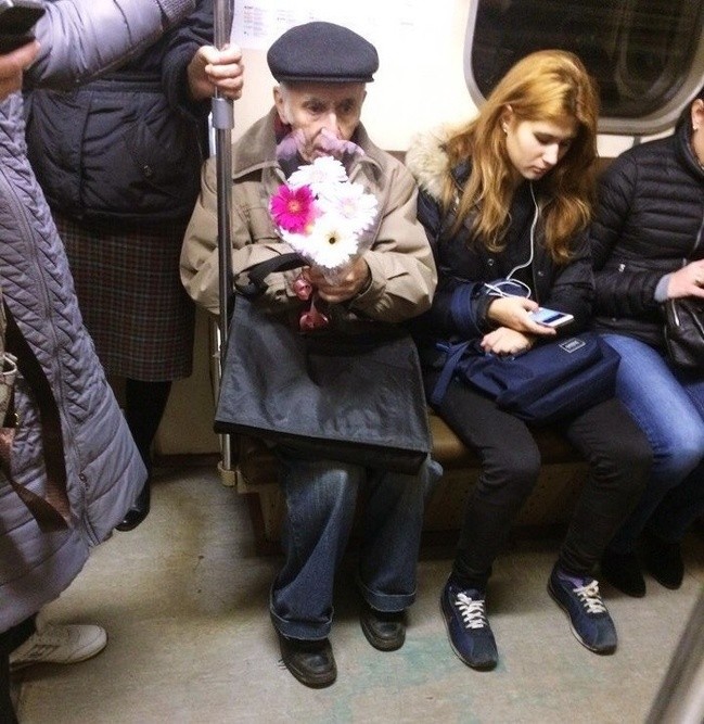 A gentleman on the subway on St. Valentine's Day.