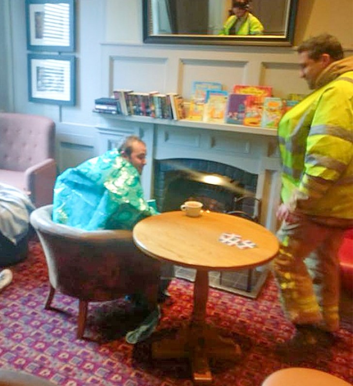 A man warms up in a bar after saving a life.