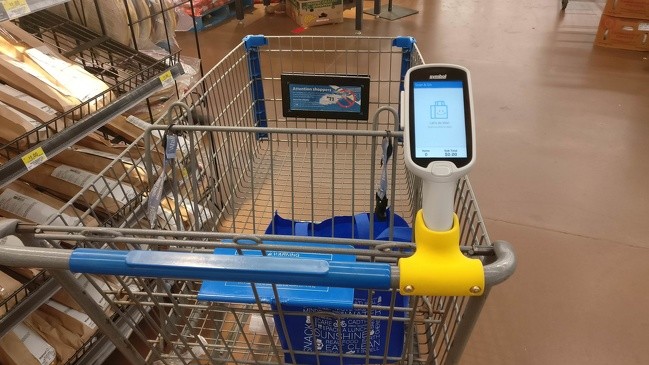 A trolley equipped with a scanner for fast calculation of the total expenditure.