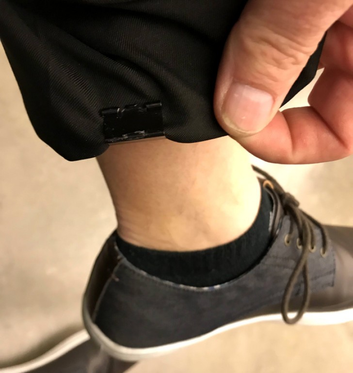 Use an office clip to hold up the hem of your pants.