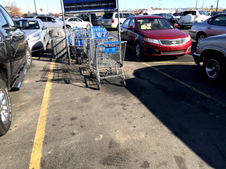 4. This photo shows how people are so lazy that they do not put their shopping cart back where they got it.