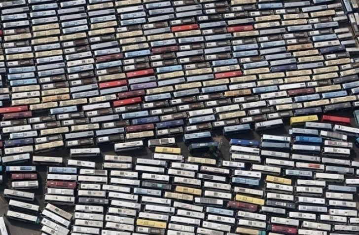 13. Music cassettes in order in their jewel cases? No ... these are dozens of buses carrying pilgrims headed to Mecca