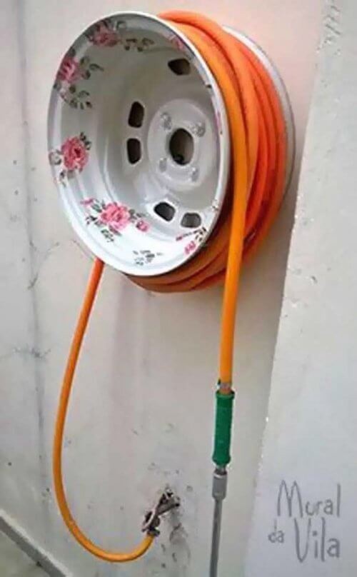 8. Creative upcycling provides a clever way to roll up and store your garden hose!