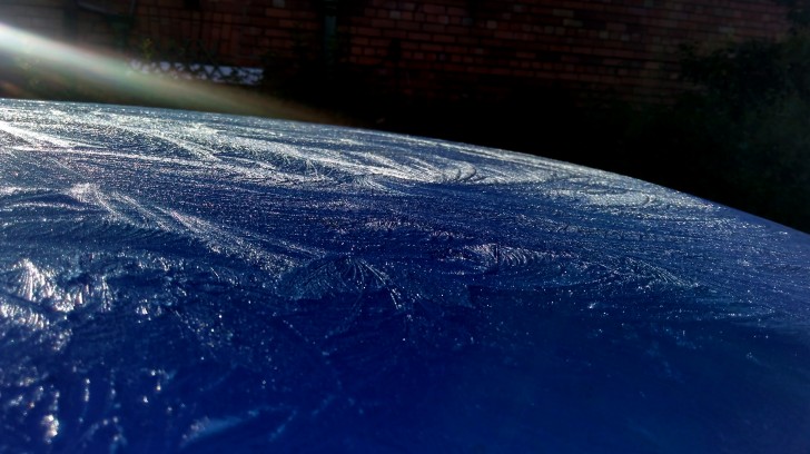 This morning the ice on the hood of my car looks like the Earth seen from space.