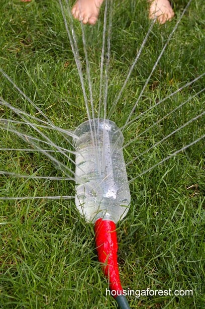 8. Do you need an irrigator? Nothing could be simpler! Just drill some holes in a plastic bottle and insert the hose you use to water the lawn!