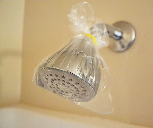 There is no need to soak, rinse and rub. To remove limescale from the shower head, just attach a small plastic bag with a little white vinegar in it!