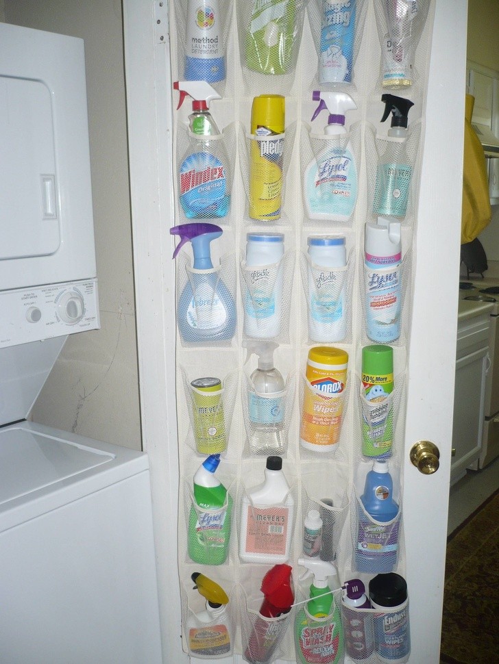 Here is a way to solve the problem of organizing and storing cleaning products. These transparent plastic hanging storage pockets always come in handy!
