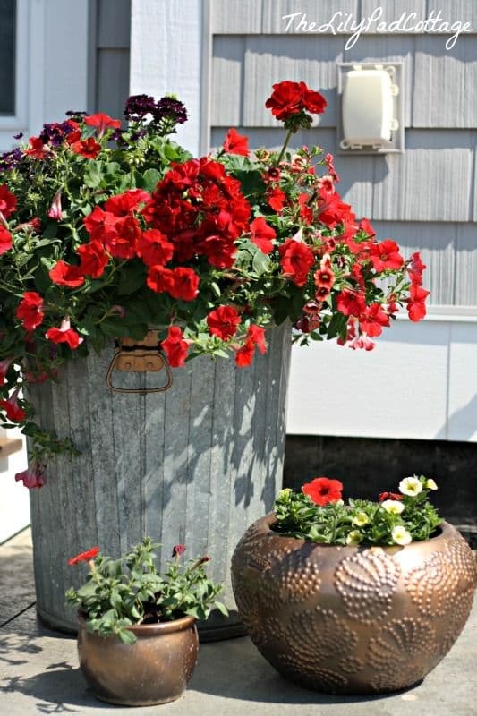 1. A garbage can becomes a colorful planter.