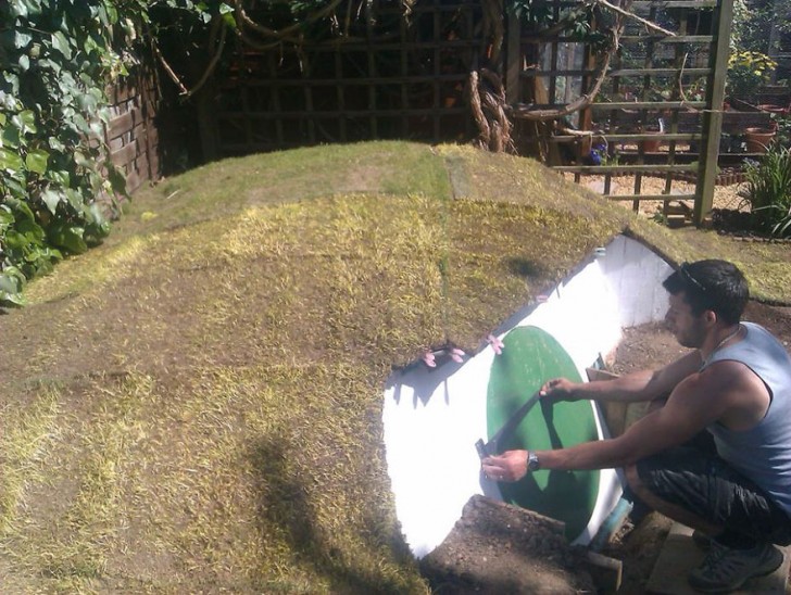 Hobbit houses are literally built into hills, so Ashley covered his with modular synthetic turf grass panels.