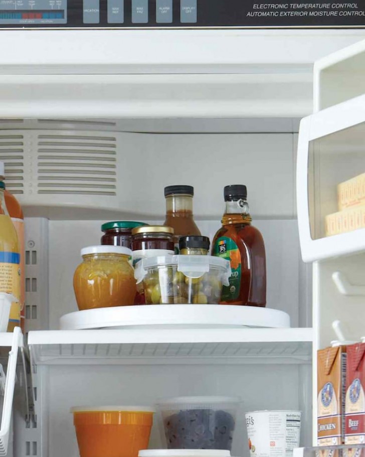 Jars and bottles over time dirty the fridge! Why not put them all together and place them on a fridge turntable that will make cleaning easier?!