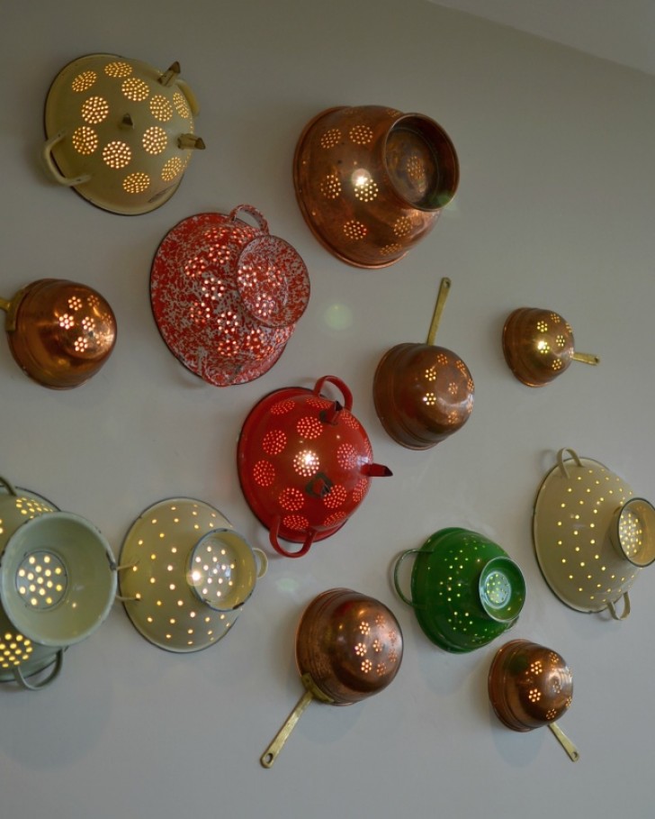 6. An old rusty colander easily becomes a suggestive wall lamp!