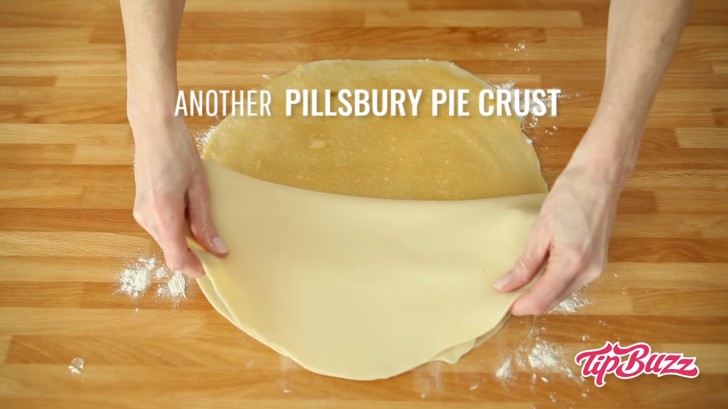 3. Place the second disc of puff pastry on top.