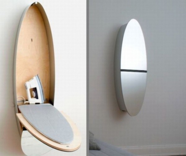 4. A wall mirror can hide an entire ironing board!